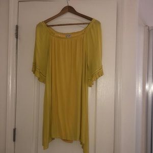 Yellow dress, it’s styled as off the shoulders.